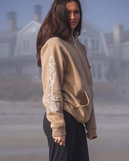Side view of KTK hoodie showing sleeve graphics